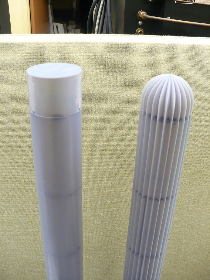 Comparison of the flat-topped smooth cylinder and hemispherical cap on the grooved cylinder